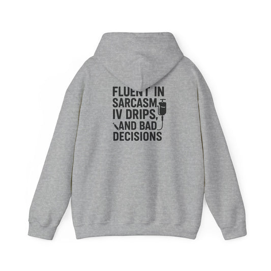 “Fluent in Sarcasm, IV Drips, and Bad Decisions” – Chaotic Nurse Hoodie